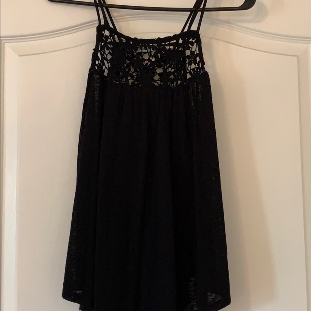 A black tank top with a lace detail